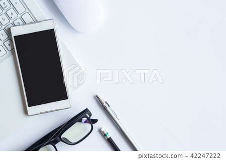 White desk office with laptop, smartphone White desk office with laptop, smartphone 42247222