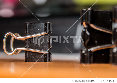 Black Paperclip Put on a wooden table 42247494