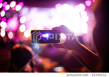 People taking photographs with smart phone People taking photographs with smart phone 42250312