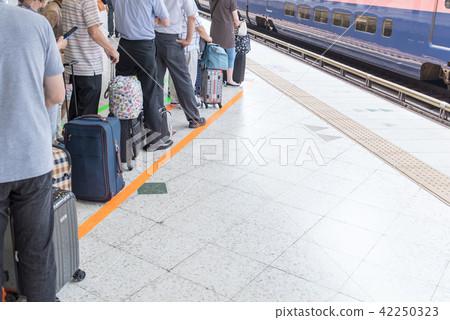 Passenger row waiting for Shinkansen Passenger row waiting for Shinkansen 42250323