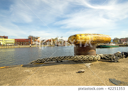 bollard in a seaport with corsair bollard in a seaport with corsair 42251353