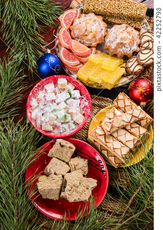 Sweets and decorations on the New Year table Sweets and decorations on the New Year table 42252798
