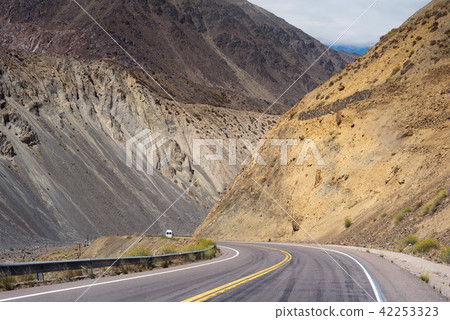 Mountain view of argentina with car driving street Mountain view of argentina with car driving street 42253323