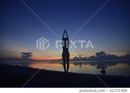 Morning glow and yoga pose of Shiraho Beach Morning glow and yoga pose of Shiraho Beach 42255309