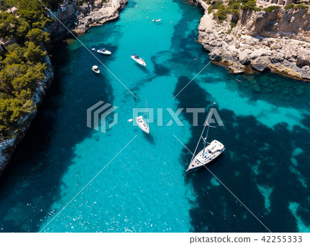 Aerial: Cala Llombards beach in Mallorca, Spain 42255333