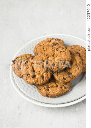 Homemade cookies with chocolate in a plate Homemade cookies with chocolate in a plate 42257040