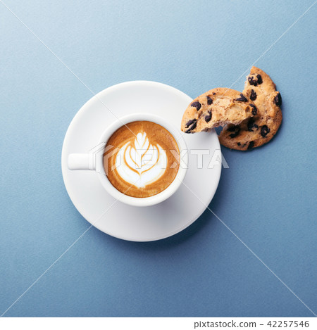 A cup of coffee and cookies. A cup of coffee and cookies. 42257546