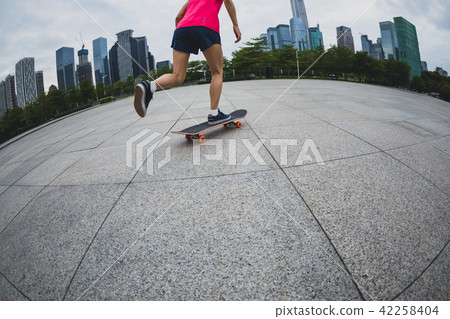 skateboarder riding skateboard on urban city 42258404