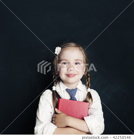 Happy little girl with red school book Happy little girl with red school book 42258546