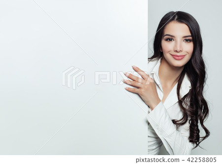 Happy Businesswoman showing white empty banner 42258805