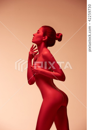 fashion art photo of elegant nude model in the light colored spotlights fashion art photo of elegant nude model in the light colored spotlights 42259730