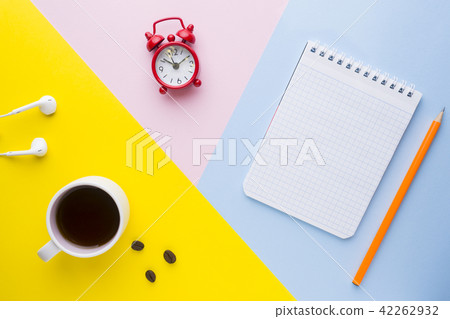 Cup of coffee, an alarm Clock And a notebook  42262932