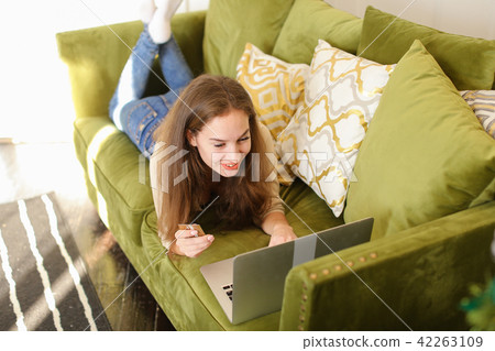 visagist lady communicating with friend using laptop. 42263109