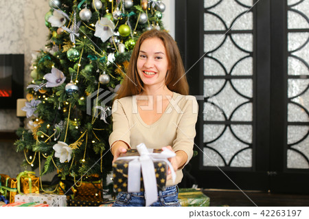 economist posing for photo with present box. economist posing for photo with present box. 42263197