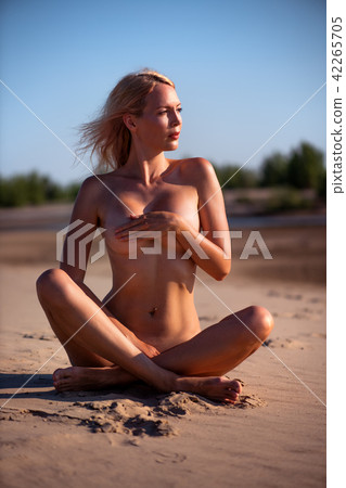 Beautiful girl model on sandy beach of the sea 42265705