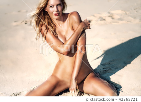 Beautiful girl model on sandy beach of the sea 42265721