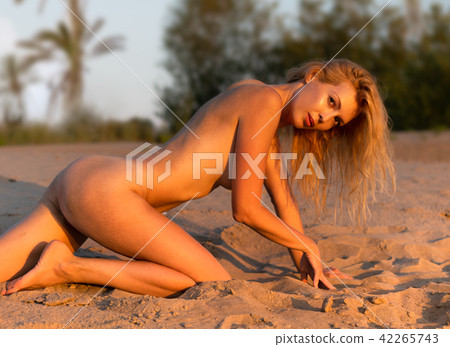 Beautiful girl model on sandy beach of the sea 42265743