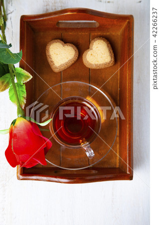 Heart-shaped biscuits, rose and tea Heart-shaped biscuits, rose and tea 42266237