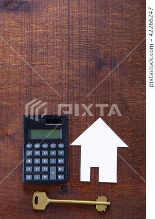 Cardboard house,calculator and key 42266247