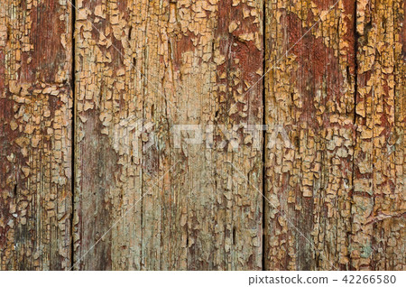 Old boards with cracked rusty paint. Textured wooden old background with vertical lines Old boards with cracked rusty paint. Textured wooden old background with vertical lines 42266580
