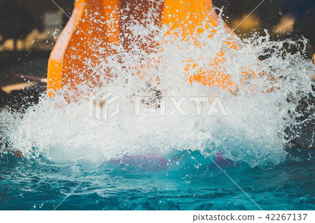 splashings from girl gone down by the slide in aqua park splashings from girl gone down by the slide in aqua park 42267137