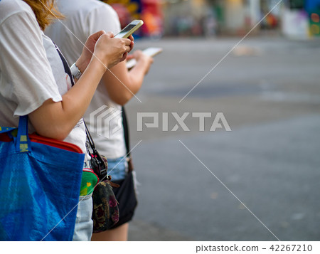 Woman using smartphone in the city 42267210