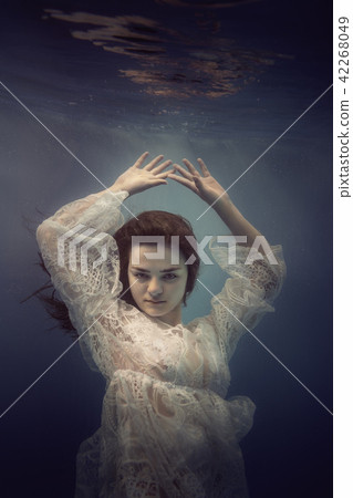 Portrait of a girl in a lace dress under the water Portrait of a girl in a lace dress under the water 42268049