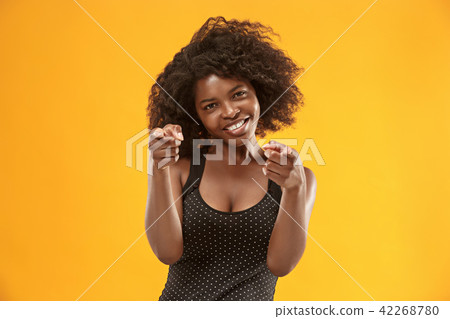 The happy business woman point you and want you, half length closeup portrait on gold background. The happy business woman point you and want you, half length closeup portrait on gold background. 42268780