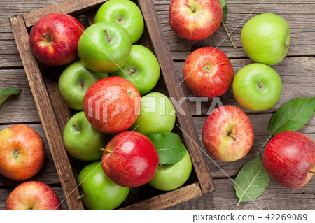 Green and red apples in wooden box Green and red apples in wooden box 42269089