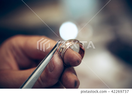 Different goldsmiths tools on the jewelry workplace. Jeweler at work in jewelry. Different goldsmiths tools on the jewelry workplace. Jeweler at work in jewelry. 42269737