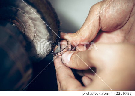 Different goldsmiths tools on the jewelry workplace. Jeweler at work in jewelry. 42269755