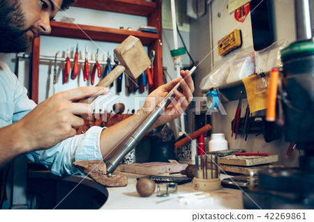 Different goldsmiths tools on the jewelry workplace. Jeweler at work in jewelry. Different goldsmiths tools on the jewelry workplace. Jeweler at work in jewelry. 42269861