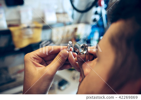 Different goldsmiths tools on the jewelry workplace. Jeweler at work in jewelry. Different goldsmiths tools on the jewelry workplace. Jeweler at work in jewelry. 42269869