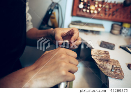 Different goldsmiths tools on the jewelry workplace. Jeweler at work in jewelry. Different goldsmiths tools on the jewelry workplace. Jeweler at work in jewelry. 42269875