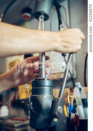Different goldsmiths tools on the jewelry workplace. Jeweler at work in jewelry. Different goldsmiths tools on the jewelry workplace. Jeweler at work in jewelry. 42269879
