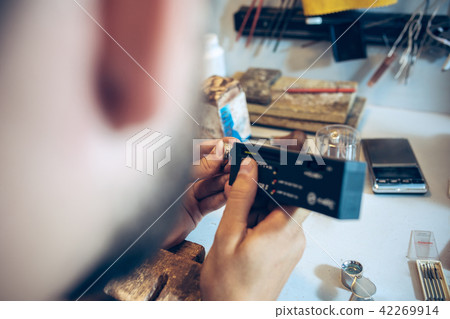 Different goldsmiths tools on the jewelry workplace. Jeweler at work in jewelry. Different goldsmiths tools on the jewelry workplace. Jeweler at work in jewelry. 42269914