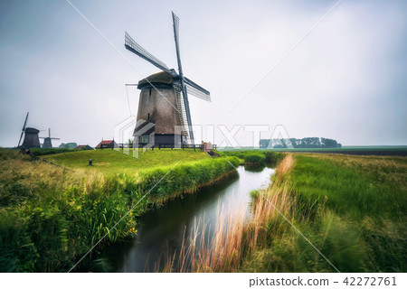 Old dutch windmills in cold morning scenery near Amsterdam Old dutch windmills in cold morning scenery near Amsterdam 42272761
