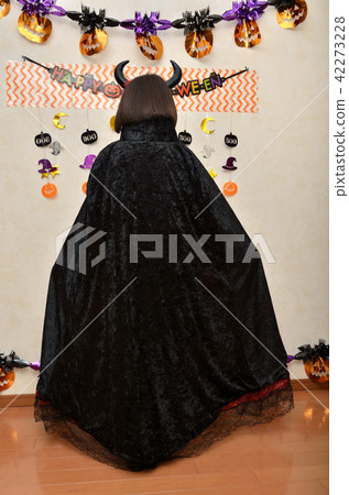 Girl enjoying Halloween party (Rear view) Girl enjoying Halloween party (Rear view) 42273228