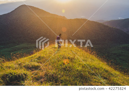 Hiking woman with backpack on mountains,   42275824