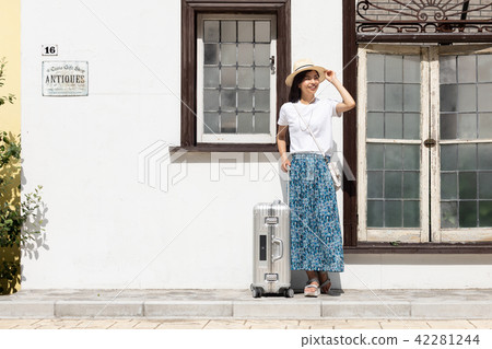 A young woman traveling alone 42281244