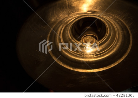 Light bulb illuminated and taken from above. 42281303