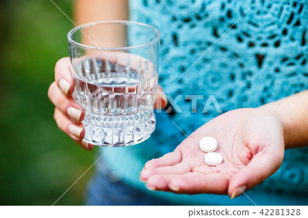 Girl holds the Medicinal pills Girl holds the Medicinal pills 42281328
