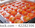 A row of mini tomatoes A row of mini tomatoes 42282306