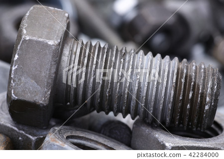 Steel bolt closeup with selective focus Steel bolt closeup with selective focus 42284000