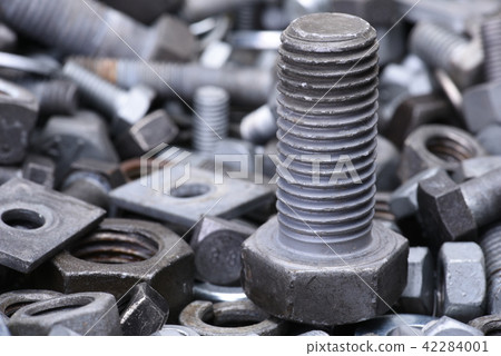 Steel nuts and bolts close up 42284001