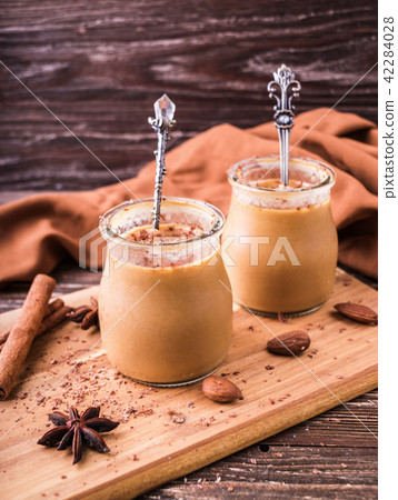 Toffee caramel dessert in jar 42284028