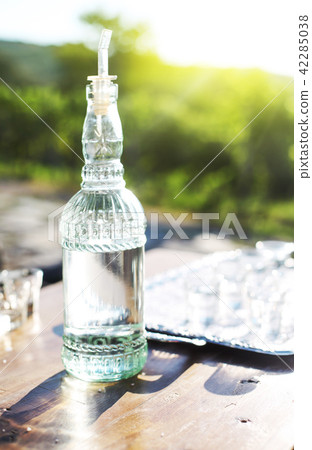 Grapes spirits bottle and glasses on metal tray Grapes spirits bottle and glasses on metal tray 42285038