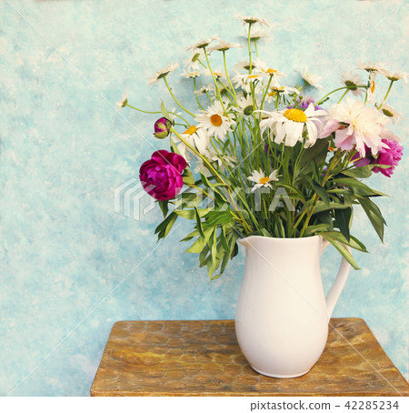 Still life with bouquet of summer flowers in a jar Still life with bouquet of summer flowers in a jar 42285234