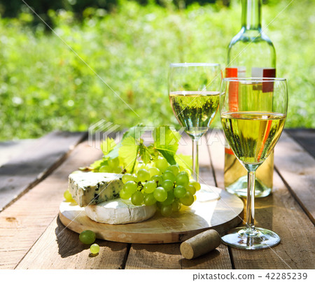 Cheese, grapes and two glasses of the white wine Cheese, grapes and two glasses of the white wine 42285239