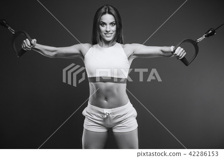 Beautiful Sexy Athletic Girl Working Out In Gym - Stock Photo [42286153 